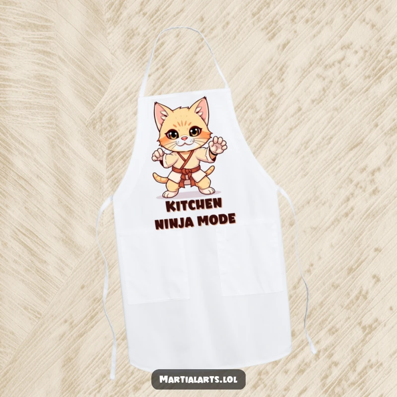 Funny curious kitten in a martial arts pose on an apron, a fun and practical kitchen accessory for aspiring ninjas.