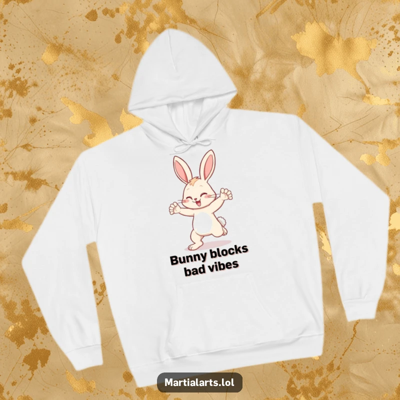 Funny bunny hoodie featuring a determined bunny blocking a kick, providing warmth and a humorous sense of security.