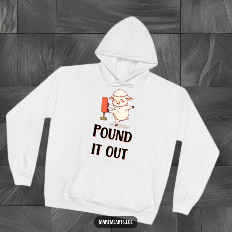 Funny hoodie showing a gleeful sheep mid-kick against a training dummy, highlighting its joyful and slightly aggressive workout.