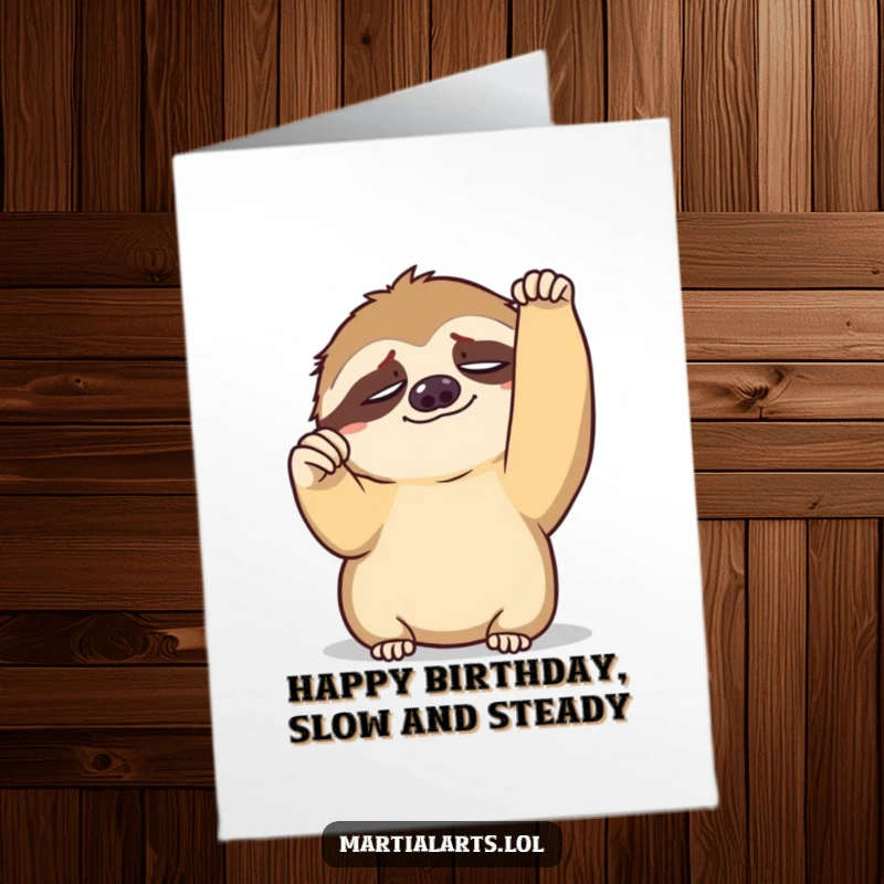 Funny Free Printable birthday card: a tired sloth slowly raising a fist in a celebratory pose.