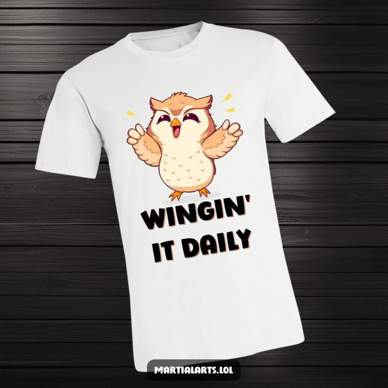 Funny t-shirt with a giggling owl enthusiastically punching the air, radiating pure joy and comic energy.